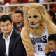 Former NBA player Yao Ming and Slamson the Lion, the Sacramento Kings' mascot, in Beijing October 15, 2014.